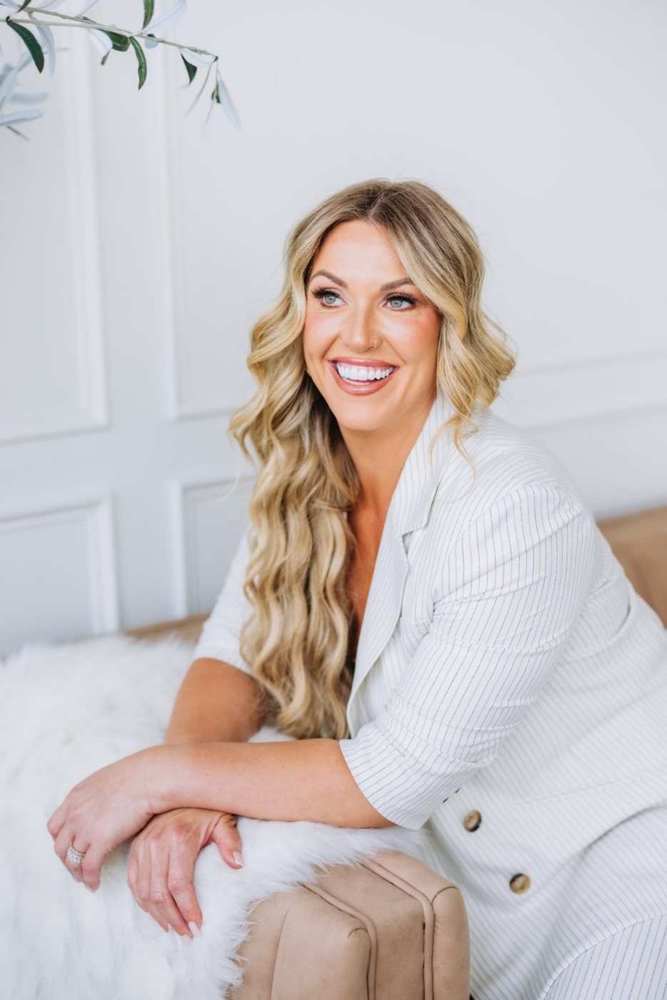 Barbara Schreihans smiling in a white blazer